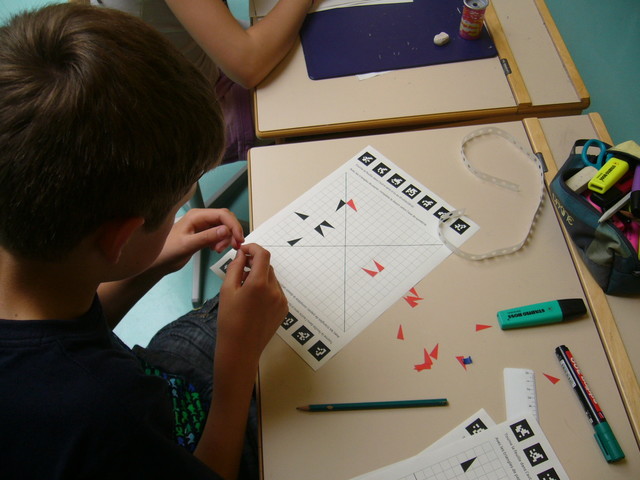 Children learn early the many ways of using paper